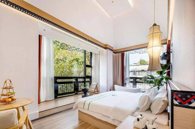 Xishu Garden Inn - Travel Agency service - Car Rent service - English Speaking